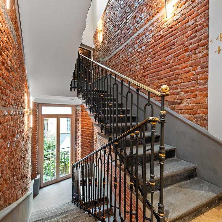 Detail of the wrought-iron interior stairs at Hotel Milu Milan